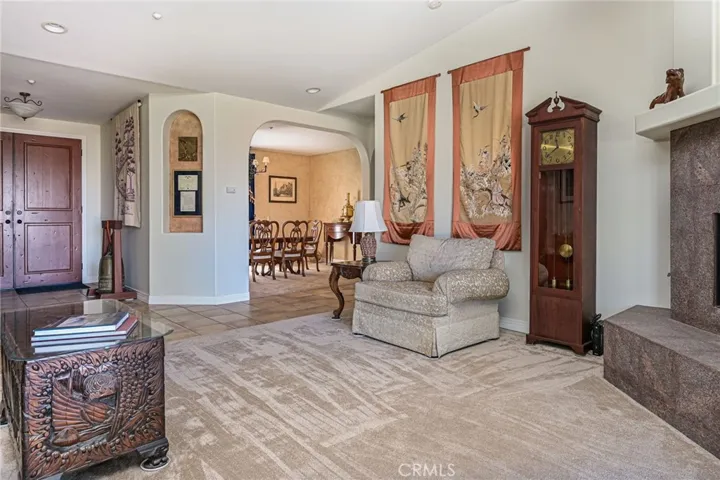 Living room looking into entry and formal dining room