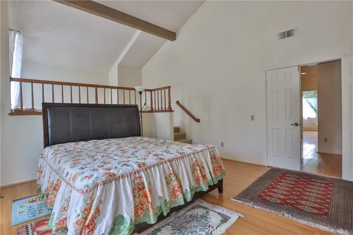 Master bedroom with vaulted ceiling