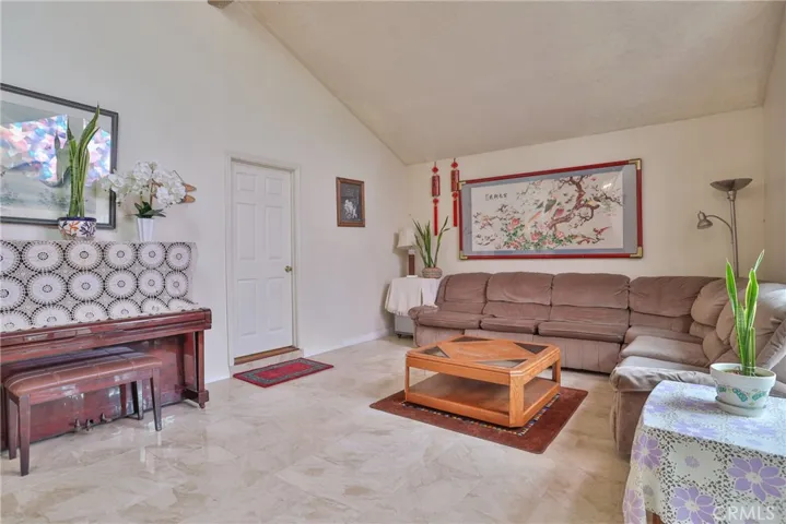 Living room with door to the bonus room