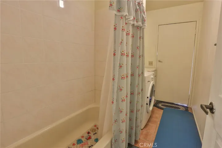 Downstairs full bath with exit to the side yard