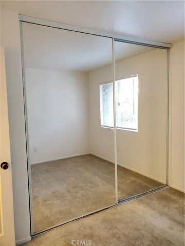 Second bedroom with mirror closet