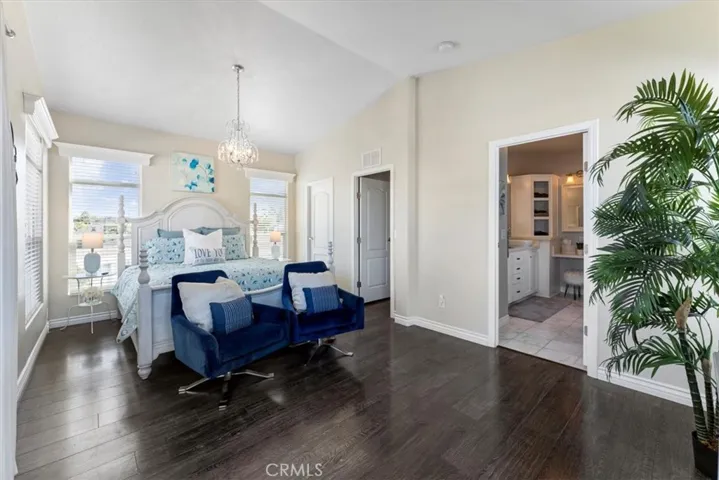 A large walk in closet on the right side of the room.