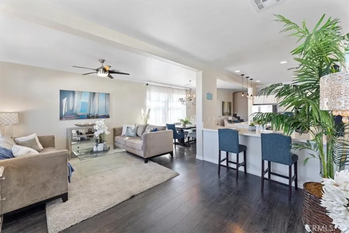 Ceiling fan, recessed lighting and another breakfast bar.