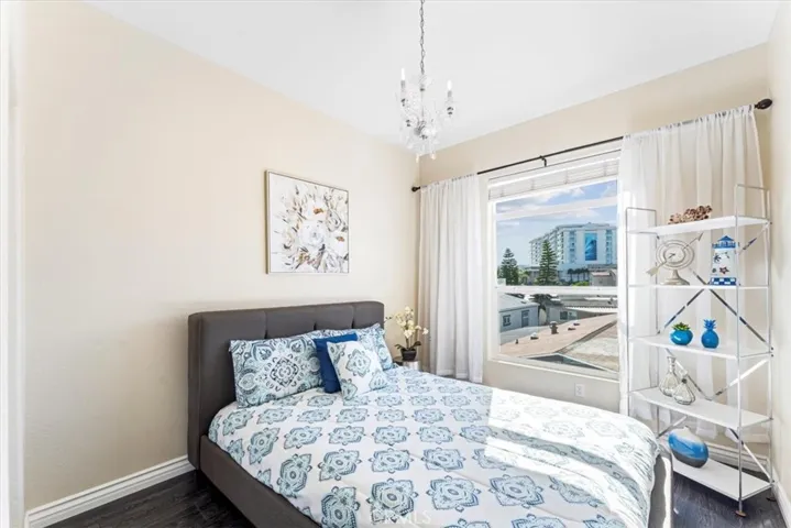 Bedroom 4 with large window to bring in the sunshine.