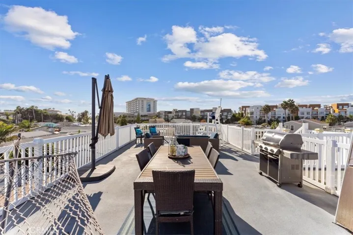 Stairway leads to rooftop deck with ocean views.