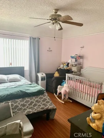 Front bedroom with ceiling fan