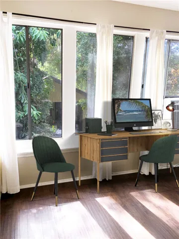 Den located off the kitchen and great/living room. It opens to the huge entertaining deck. This room also has a stack washer and dryer.