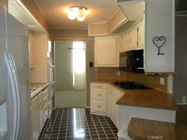Kitchen includes refrigerator