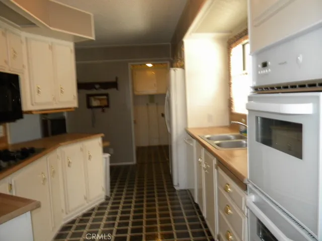 Kitchen looking into laundry room