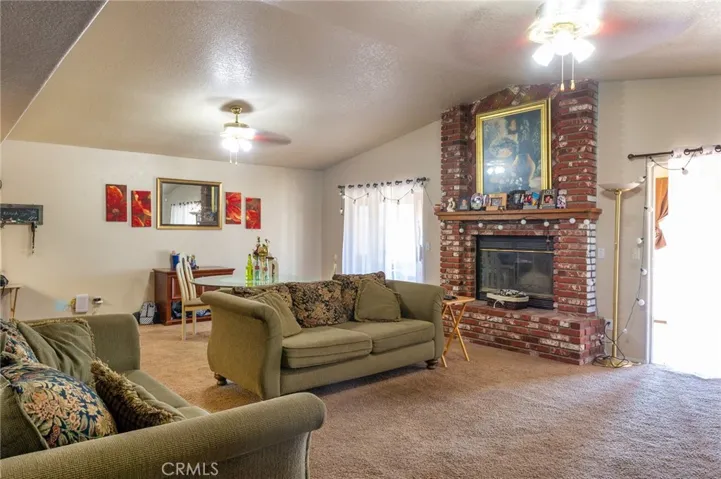 Spacious living room area with access to the sunroom and back yard