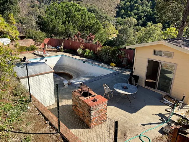 View of pool area from house (pool has not been used for app 30 years)
