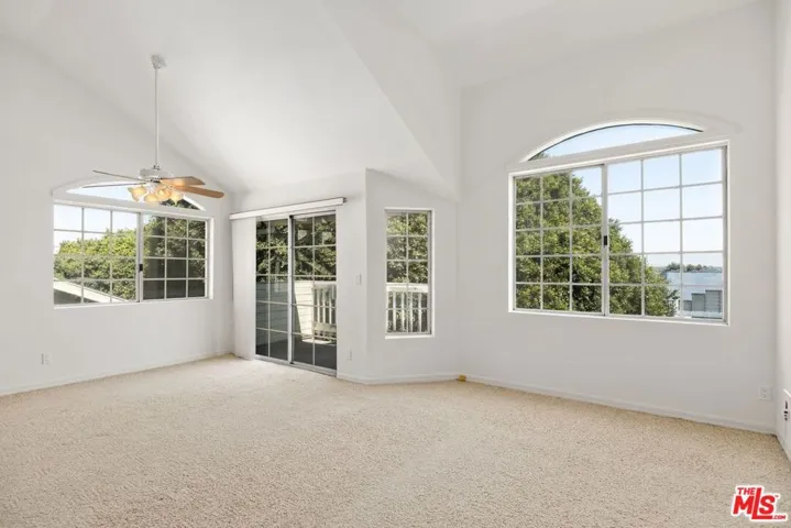 Living and dining area with large windows