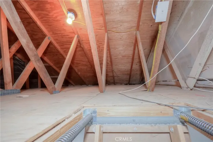 Fully lit above garage/attic storage area