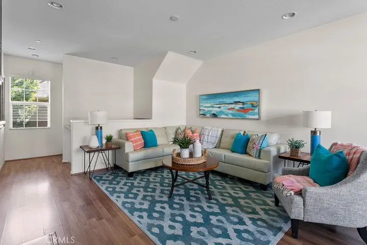 Wood style laminate floors embrace the main living area of the home.