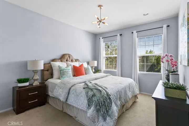 The primary suite is spacious and offers great natural light and room for a king size bed.
