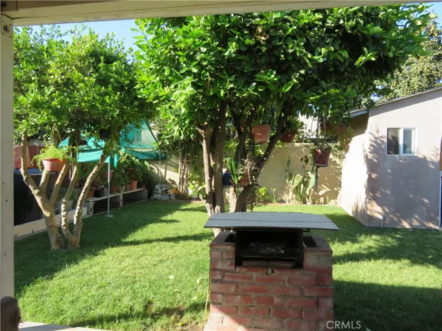 Partial view of backyard and storage shed.  well maintained