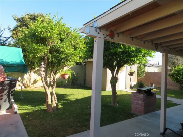 Rear patio view to backyard and large shed