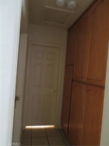 hallway storage heading to main bathroom and bedroom