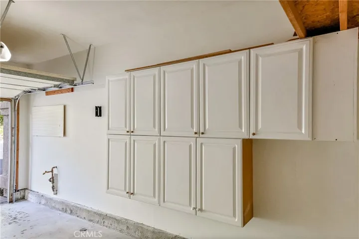Attached single car garage and second parking space is reserved and outside.