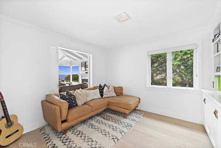 Second guest bedroom currently used as a TV room can be opened or closed off to the living room.