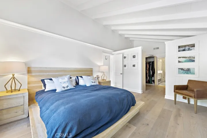 Gorgeous beamed ceilings continue on into the spacious master suite complete with custom walk in closet.