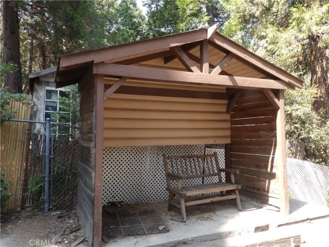 SITTING AREA THAT WOULD WORK WELL FOR A BBQ AREA.