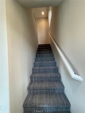 Stairs to living/dining/kitchen