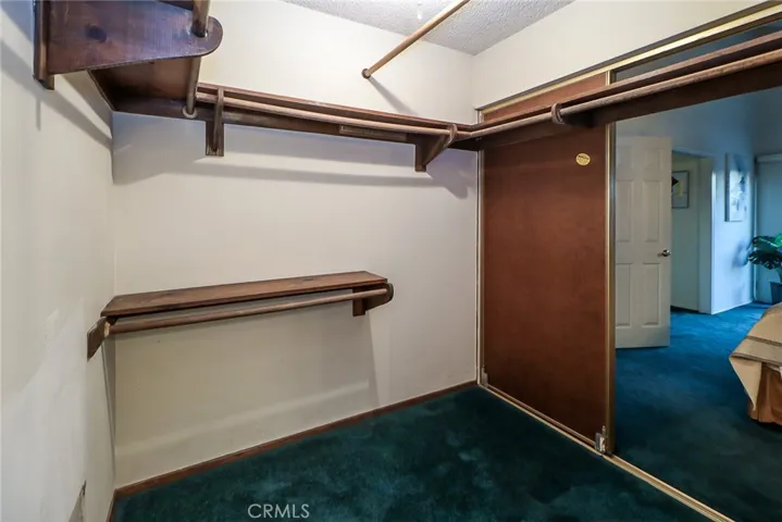Walk-through closet in Primary Bedroom