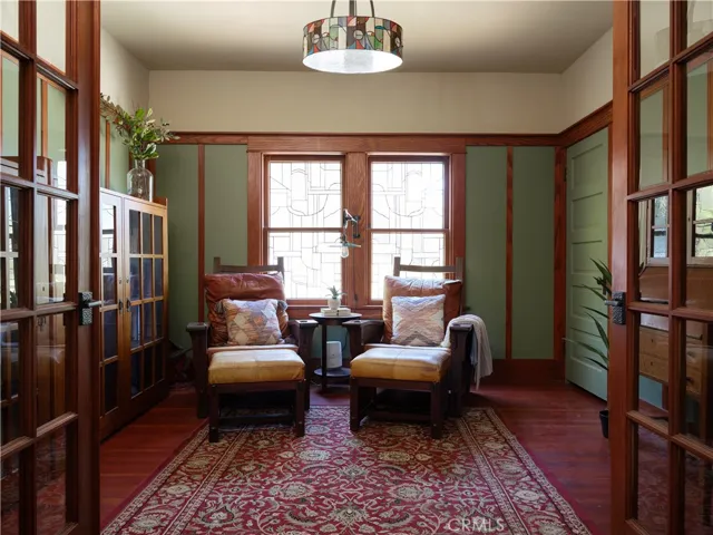 Library with custom stained glass windows (could be 4th bedroom)
