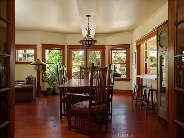 Dining area with multiple Multiple windows and French doors