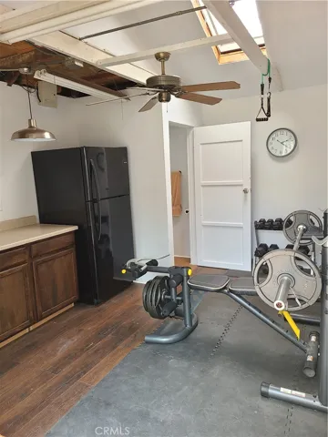 French Door Access to Added Bonus Workshop/Office attached to Garage with 1/2 bath - Currently a Home Fitness Center