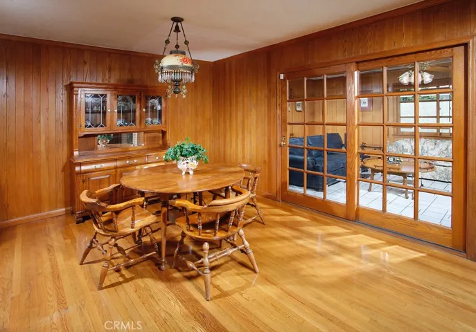 The formal dining room with its rich oak hardwood floors and easy access to the family room is perfect for any occasion.