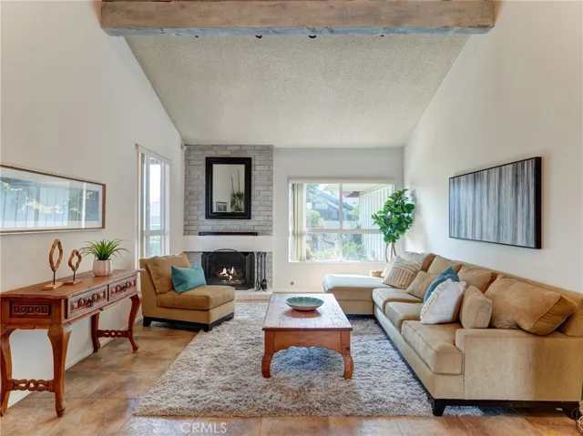 Large living room with vaulted beamed ceilings.
