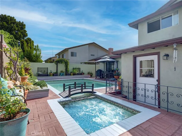Private and peaceful backyard with large swimming pool, jacuzzi, and fairytale like foot bridge.