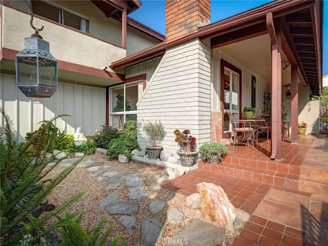Private and formal entry with peaceful garden.