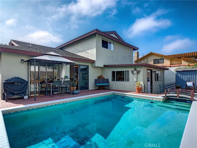 Private and peaceful backyard with large swimming pool, jacuzzi, and fairytale like foot bridge.