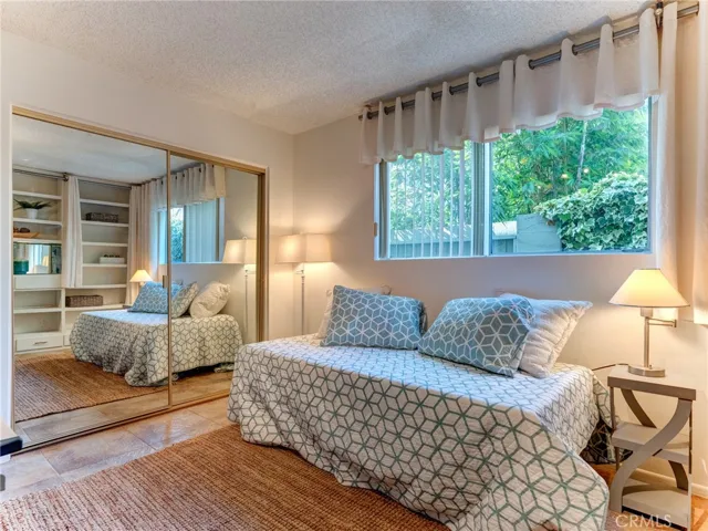 Downstairs bedroom with built in cabinetry.