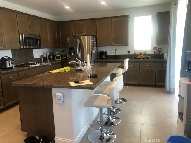 Kitchen island with bar sitting.