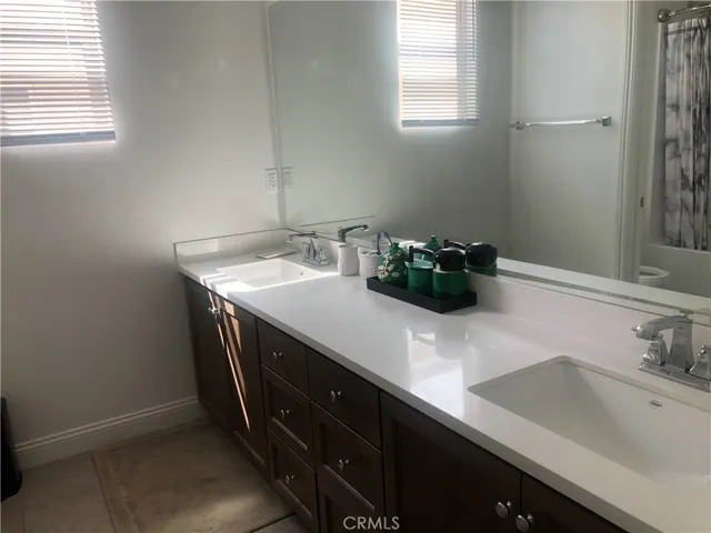 Dual sinks in the hall bath upstairs.