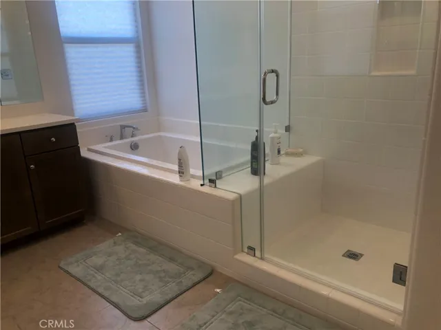 Separate shower and tub in the master bath.