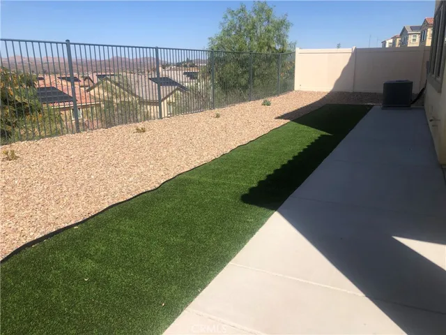 Fully landscaped backyard new artificial turf and pebbles.  Enjoy views of mountains and lake in your private backyard.