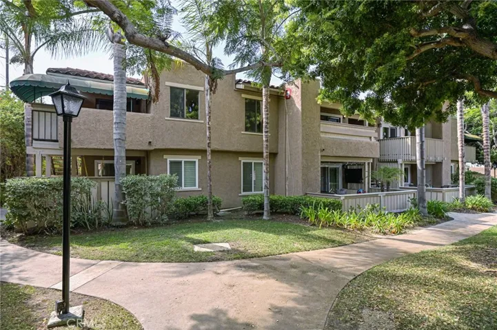 Upstairs Unit with two balconies (green awnings to be removed)