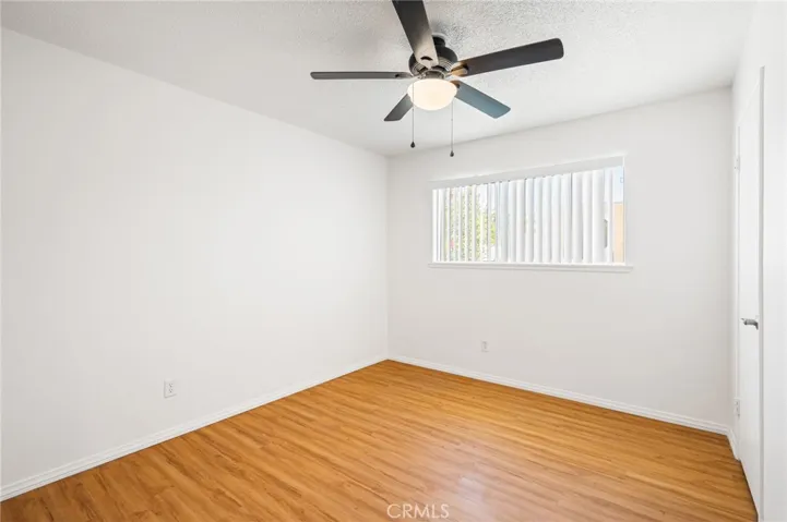 Bedroom #2 - NE with ceiling fan & blinds