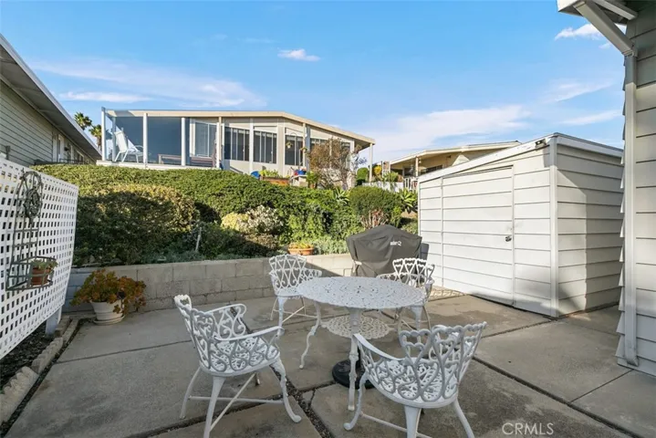 patio with big storage shed behind home