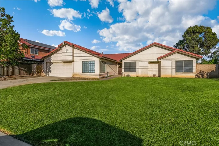 Large front yard. Oversized garage with windows and plenty of room for a workshop.