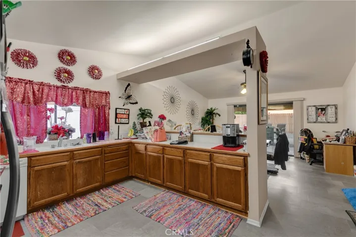 Kitchen with a breakfast bar and open to the dining room.