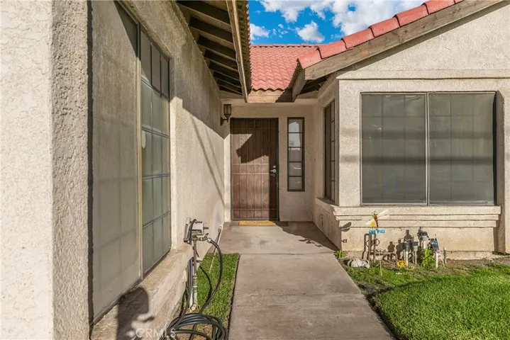 Front walkway, notice the custom screens that block the harsh afternoon sun.