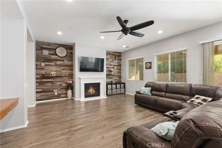 Designer wood panel wall with fireplace