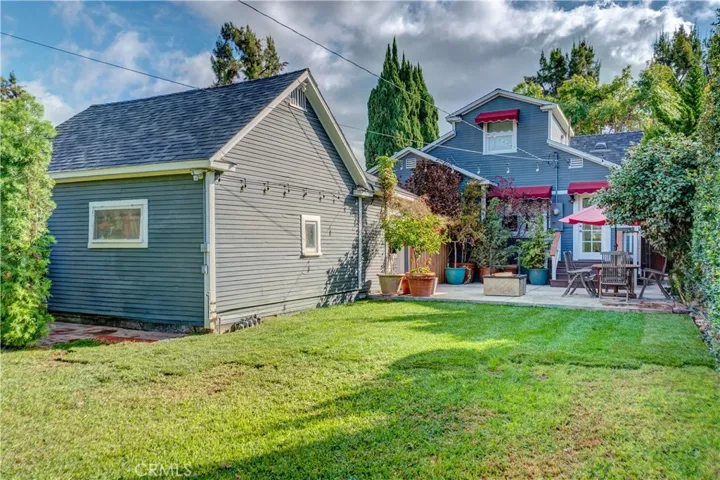 View of the back of the home and garage from the yard