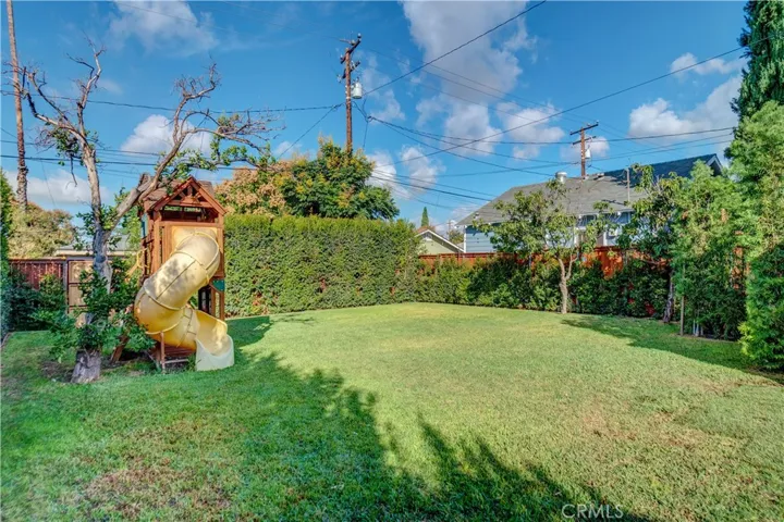 Gorgeous backyard with mature landscaping that offers beauty and privacy